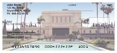 s LDS temple in Mesa is lit up at night, showing the distinctive spireless design of this temple.
